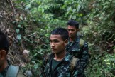 The team treks through the jungle at the peak heat hours after completing tasks for 14 hours straight.