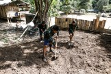 The team members partake in the leadership test--where simply digging a foundation for a new building helps teach the team humility and how to lead through action.