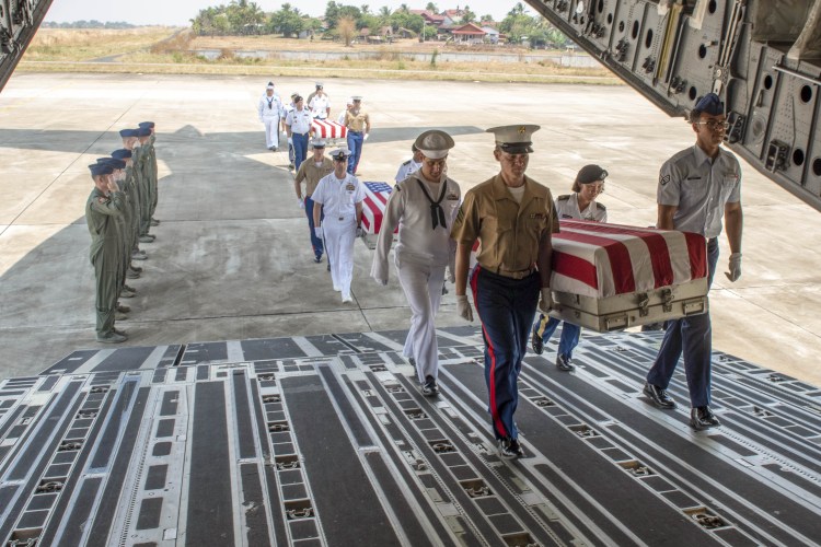 Honors procession in Laos for possible remains of unknown US service members