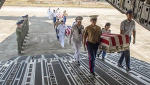 Honors procession in Laos for possible remains of unknown US service members